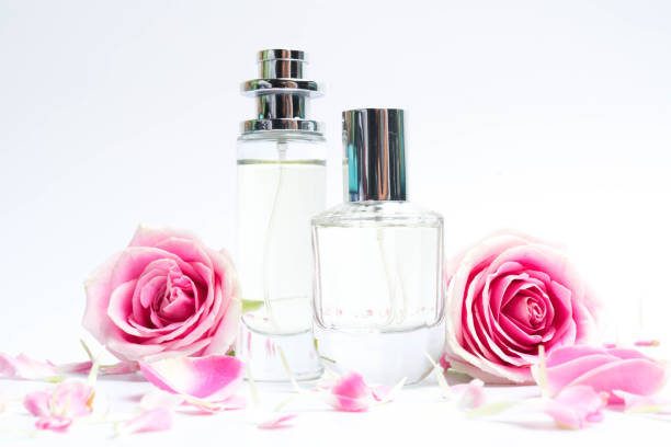 istock Beautiful perfume bottles on pink background 1177797450