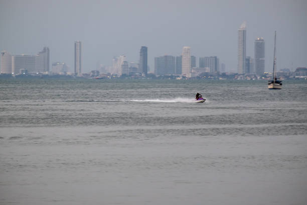 istock man drive jet ski on the sea 1177803875
