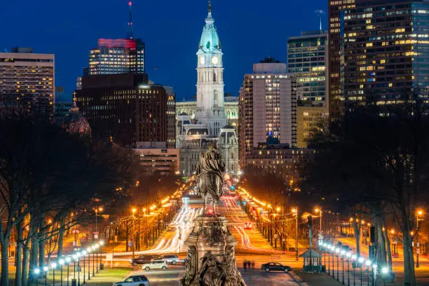 Scene of George Washington statue oand street in Philadelphia over the city hall with cityscape background at the twilight time, United States of America or USA, history and culture for travel concept