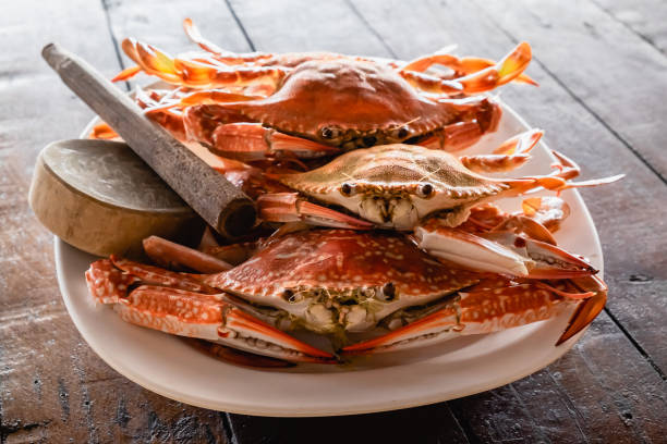 istock steamed flower crabs in the dish on wooden table 1177806957