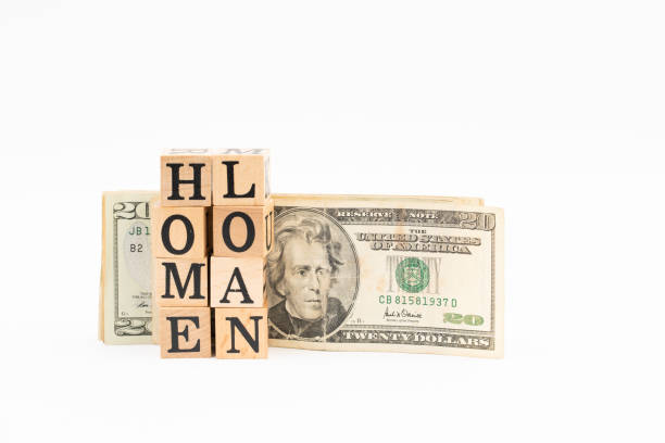 istock Wood block Home loan with dollar banknote on white background. 1177809623