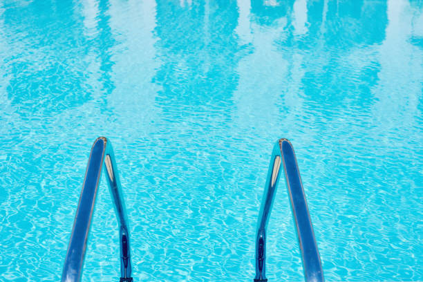 istock Background of water in blue swimming pool, water surface with a sun reflection 1177809638