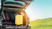 Suitcase backpack in SUV car truck for packing travel driving at mountain road and street in vacation summer road trip on holidays to destination, Traveler transportation vehicle people lifestyle