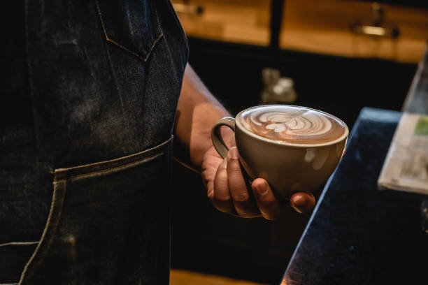 istock hand of barista make coffee latte art 1177809949