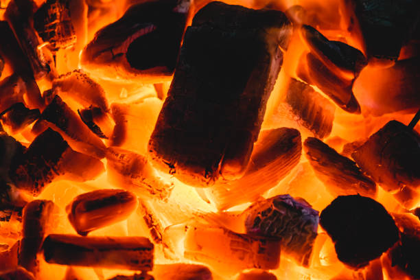 istock Burning and glowing charcoal with open hot flame 1177810681