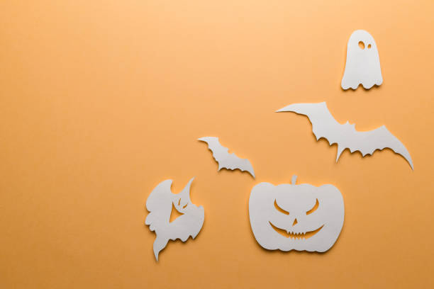 istock Halloween decorations. Halloween paper decorations on orange background. Top view. Flat lay of accessory decoration Halloween festival. Copy space. Minimal creative concept. Pastel colors 1177810893