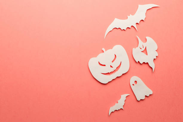 istock Halloween decorations. Halloween paper decorations on coral background. Top view. Flat lay of accessory decoration Halloween festival. Copy space. Minimal creative concept. Pastel colors 1177810936
