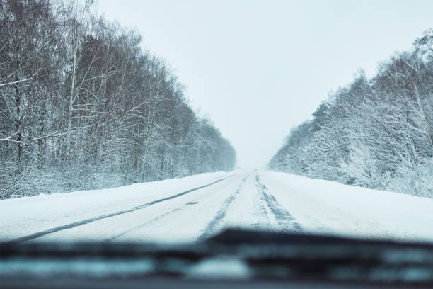 istock View from car on snowy winter road 1177811081