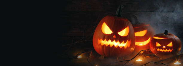 istock Halloween pumpkins and candles 1177816695