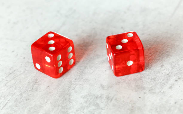 istock Two translucent red craps dices on white board showing Hard Six (double number three) 1177818261