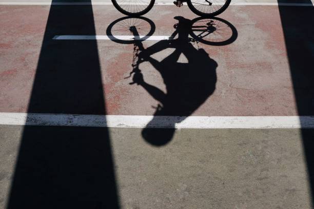 istock bicycle transportation shadow silhouette on the street 1177820310