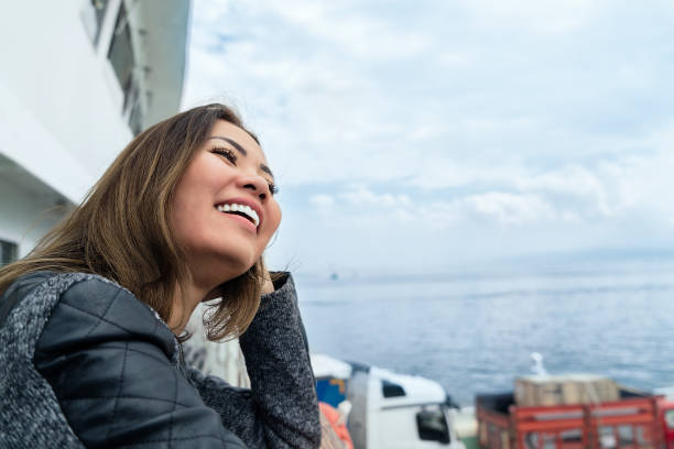 istock Woman travelling by ferry, getting away from it all 1177821161