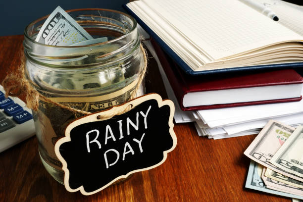 istock Rainy Day Fund label on the jar with money. 1177821499
