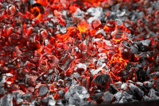 istock Texture red hot coals, selective focus. Barbecue grill dark background 1177823189