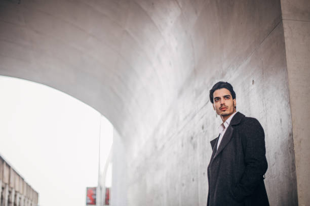 istock Handsome man in black coat portrait 1177824357