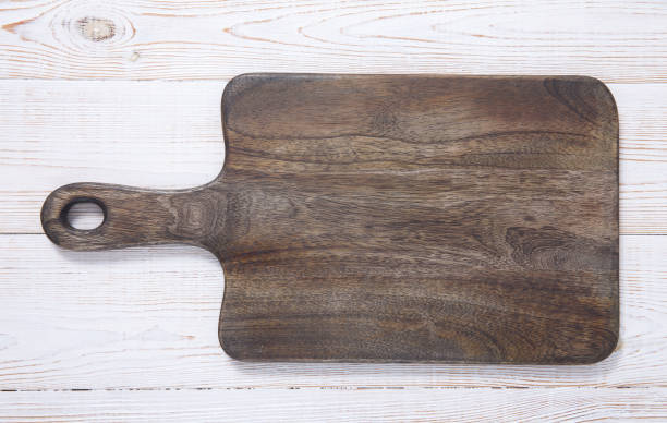 istock Cutting board on the wooden background. Top view. 1177826326