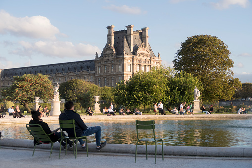 Paris, France - Sept 04, 2019: People relaxing in Tuileries Garden (Jardin des Tuileries), Paris, France