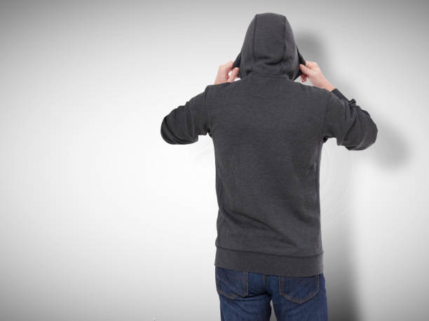 istock Man in black sweatshirt, black hoodies rear view. grey background 1177827482