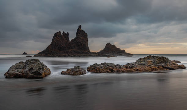 istock Rock formations in the beach with a Long Exposure time. 1177830483