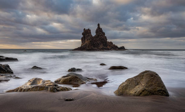 istock Rock formations in the beach with a Long Exposure time. 1177830507