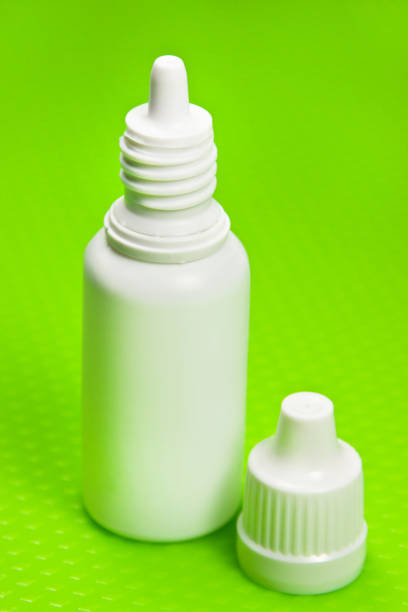 istock Medical eye drops and green background 1177831926