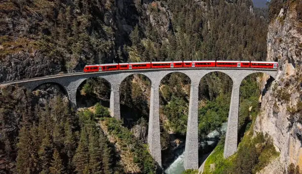 Photo of Aerial view of train on famous Landwasser Viaduct (Landwasserviadukt), Graubunden, Switzerland.