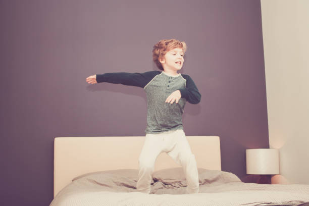 istock Playful boy having fun in the bedroom. 1177836052