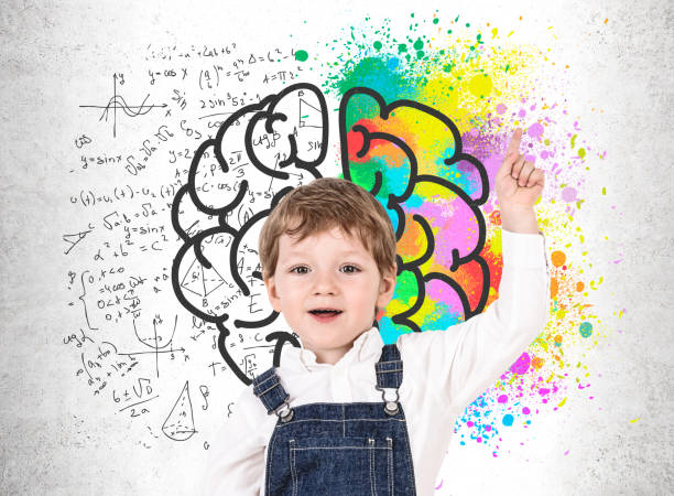 istock Cute little boy pointing up near brain sketch 1177836210