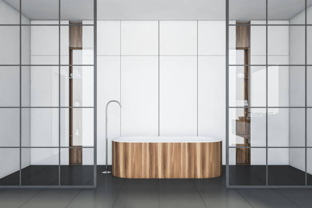 istock White tile and glass bathroom interior with tub 1177837430