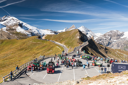 Grossglockner,Austria - September 14, 2019: 18th Oldtimer Tractor Fare WM at Grossglockner High Alpine Road in Austria in September 14th 2019. Old tractors and agricuture machinery come every year at top of Grossglockner Alpine Road to celebrate this annual event in heart of Tirol , Austria.