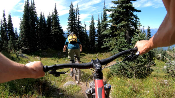 istock POV of mountain biker descending mountaintop trail 1177839165