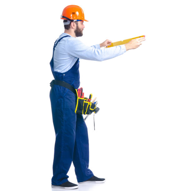 istock Man worker builder with helmet and tool belt, building level 1177839869