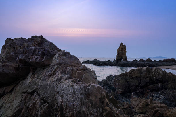 istock scenic of twilight sky with seascape rock background 1177841693