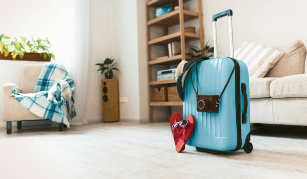 istock Travel suitcase standing on floor in the room. 1177844545