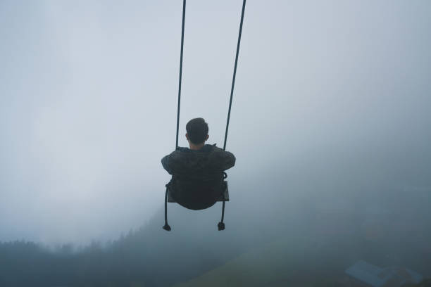 istock Man swinging on the mountain 1177848409