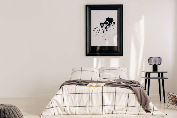 istock Black and white map in black frame in trendy bedroom interior with chequered bedroom 1177849677