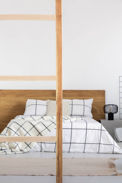 istock View of fashionable bedroom interior with copy space on empty wall 1177849683