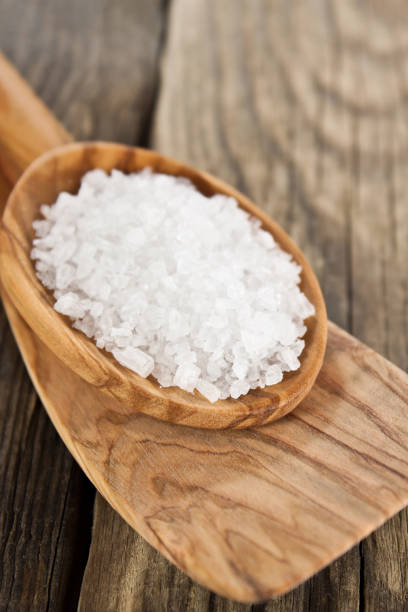 istock Salt and wooden spoons close up 1177851227