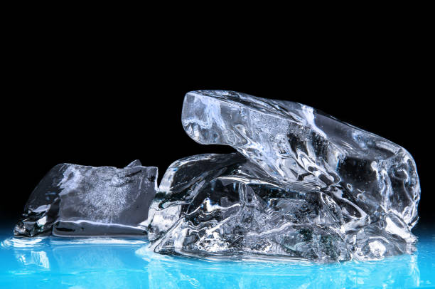 istock Piece of ice block on the black background 1177851584