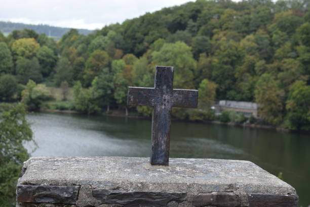 istock old stone cross in front of caldera lake 1177852853