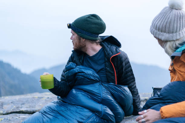 istock Couple camping without a tent prepare a hot drink 1177853191