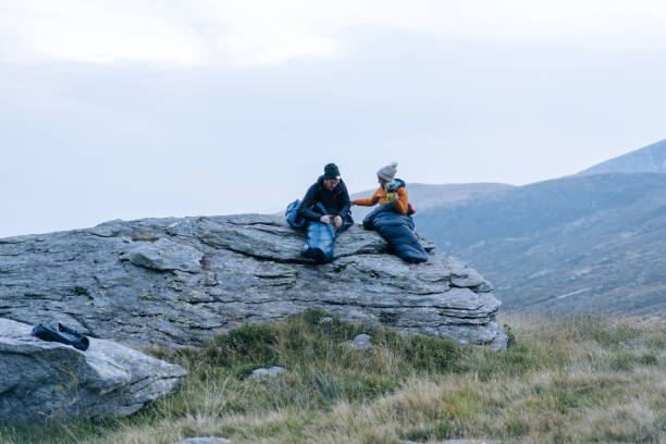 istock Couple camping without a tent prepare a hot drink 1177853252