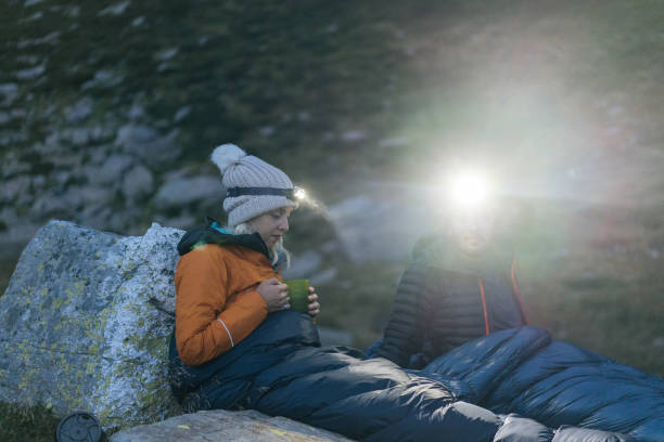 istock Couple camping without a tent prepare a hot drink 1177853258