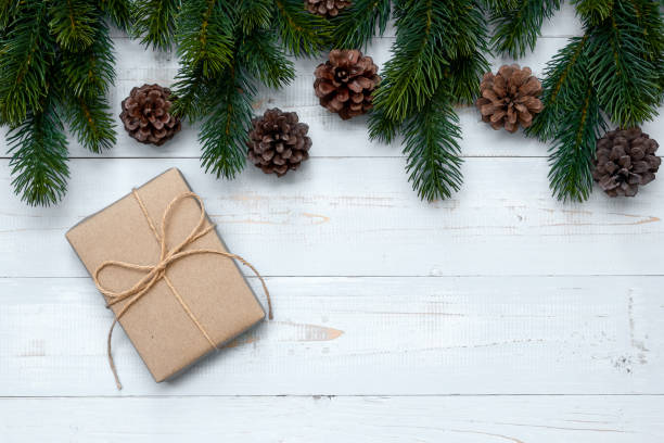 istock Christmas decoration, gift box and pine tree branches on wooden background, preparation for holiday concept, Happy New Year and Xmas Holidays. Top view and Copy Space for text 1177854710
