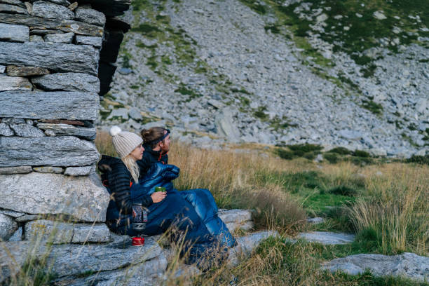 istock Couple cook on stove while rough camping 1177855709