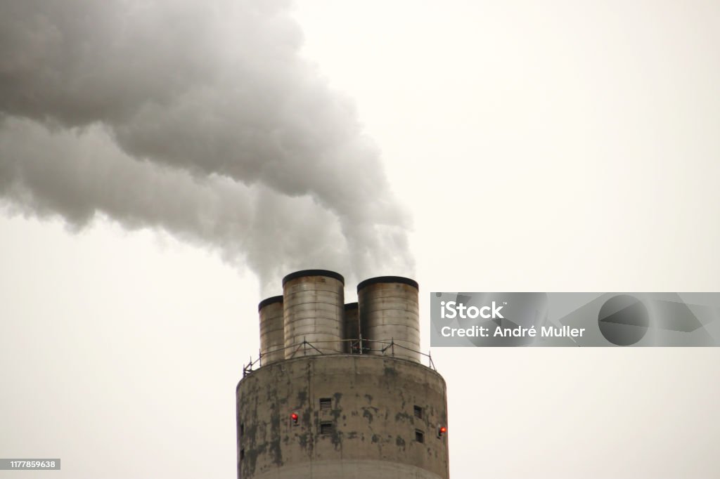 Steam and water vapour coming out of chimney of waste company AEB in Amsterdam the Netherlands Air Pollution Stock Photo