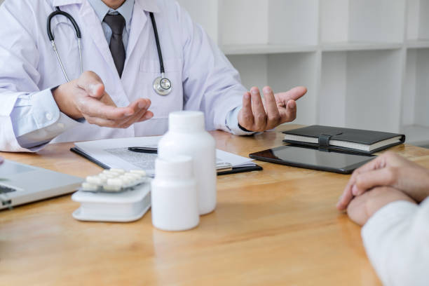 istock Professor Doctor consulting with patient discussing something and recommend treatment methods, Presenting results on report, Medicine and health care concept 1177859762