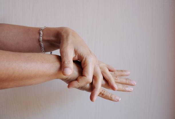 istock woman spreads the cream on her hands 1177860578