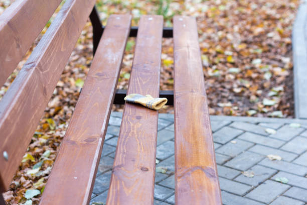 istock lost children's mittens lying alone on a bench in the Park 1177865229