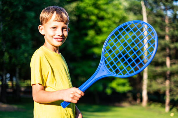 istock Portrait small boy holding tennis racket 1177866681